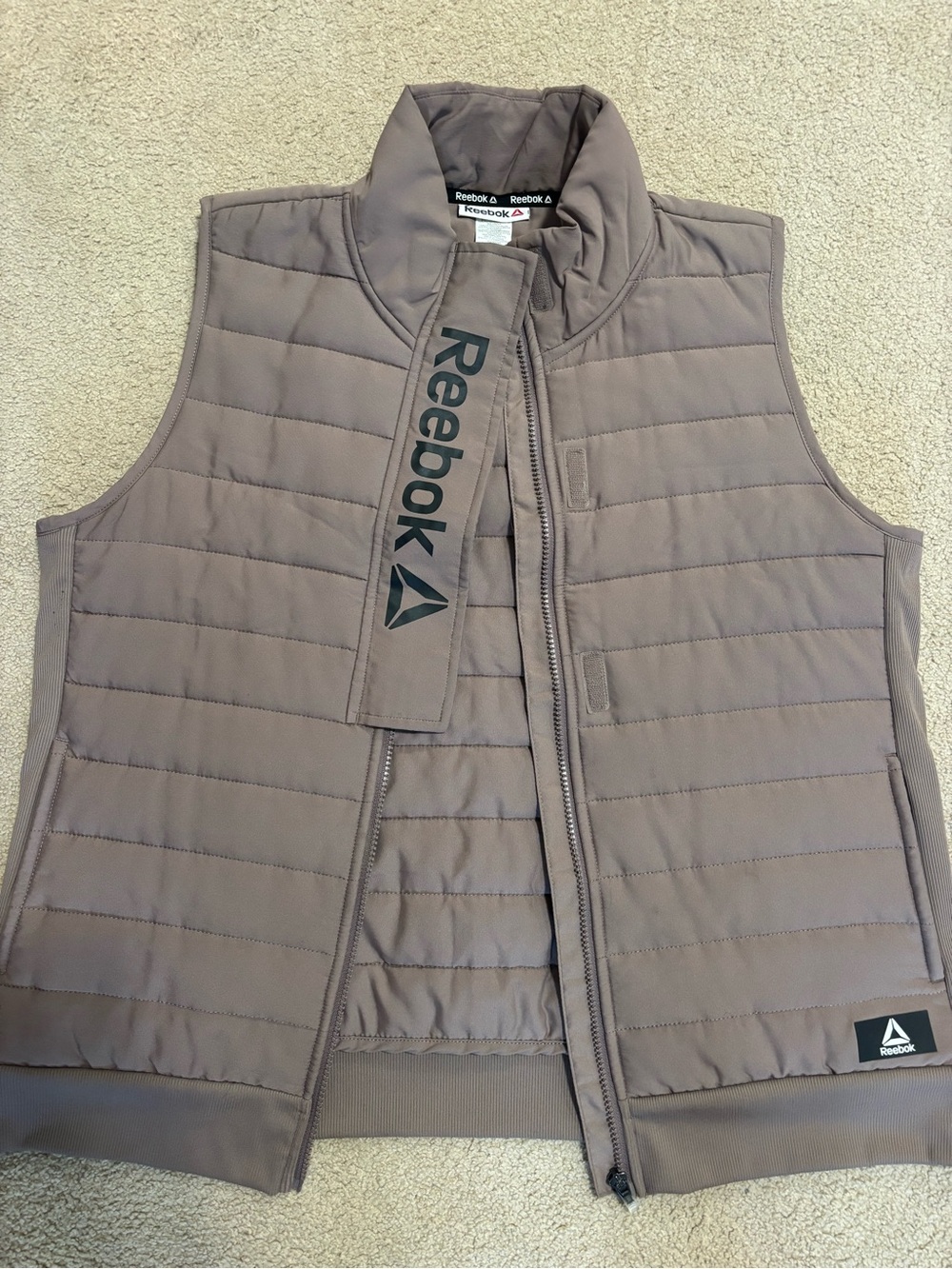 Reebok Women’s Quilted Sleeveless Puffer Vest in Taupe